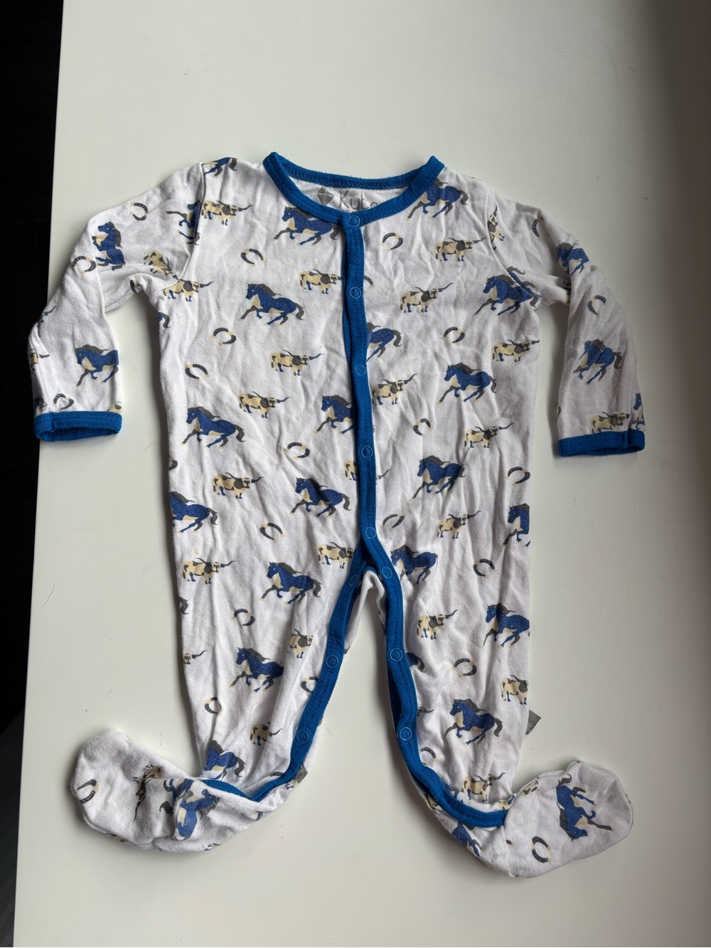Kyte baby 3-6m footie in “stampede” blue horse print